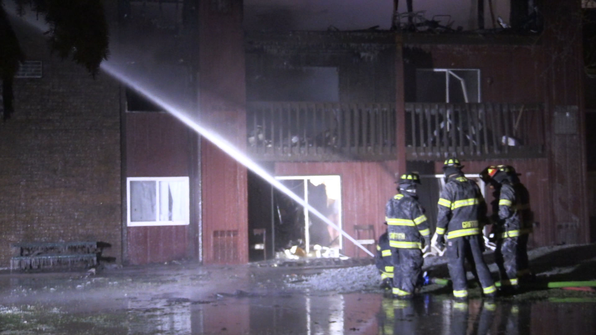 Firefighters continue to battle apartment building fire